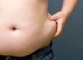 Fat people Overweight Boy pinching fat around his waist 5 Things Fat People Are Tired Of Hearing. Tomatoheart 2